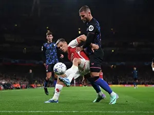 Arsenal V Sevilla 2023-24 Prints: Arsenal's Trossard Fends Off Sevilla's Gudelj in Intense UCL Showdown