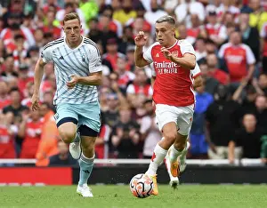 Arsenal's Trossard Outruns Forest's Wood in 2023-24 Premier League Clash