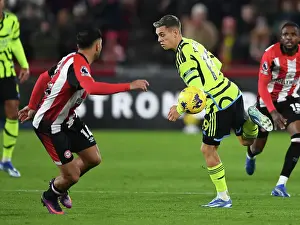 Arsenal's Trossard Scores Past Brentford's Ghoddos in Premier League Clash (2023-24)