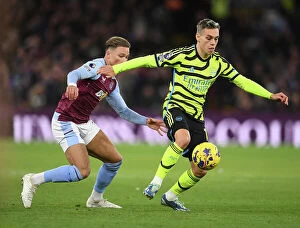 Images Dated 9th December 2023: Arsenal's Trossard Thwarted by Villa's Cash in Intense Aston Villa vs