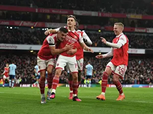 Arsenal's Trossard, Xhaka, and Zinchenko Celebrate Goal Against Brentford in Premier League