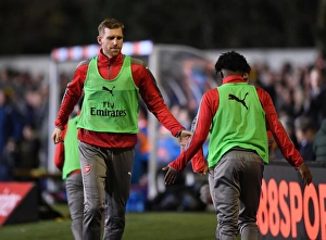 Arsenal's Unforgettable FA Cup Encounter: Per Mertesacker and Ainsley Maitland-Niles High-Five at Sutton United