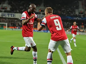 Montpellier V Arsenal 2012-13 Prints: Arsenal's Unforgettable Goal Celebration: Podolski and Diaby's Emotional Moment (2012-13)