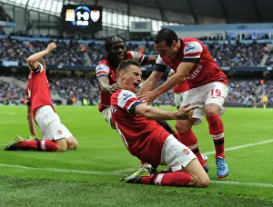 Arsenal's Unforgettable Goal: Koscielny, Gervinho, Cazorla, and Mertesacker Celebrate at Etihad Stadium (Manchester City vs Arsenal, 2012)