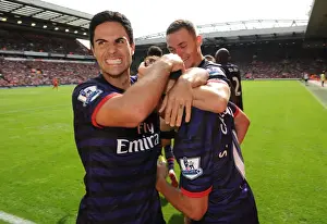 Arsenal's Unforgettable Goal: Mikel Arteta and Santi Cazorla Celebrate at Anfield (2012-13)