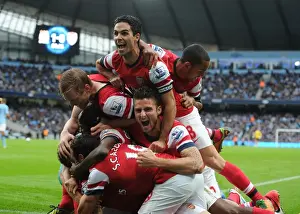 Arsenal's Unforgettable Moment: Koscielny's Goal Celebration with Team Mates Mertesacker, Gervinho, Cazorla, Arteta, and Walcott