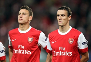 Arsenal V SC Braga 2010-11 Prints: Arsenal's Unstoppable Defense: Koscielny and Squillaci Shine in 6-0 Victory over SC Braga (UEFA Champions League)