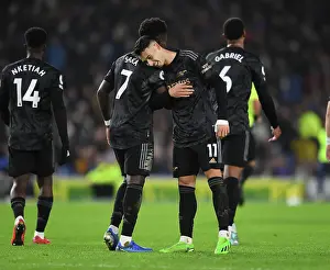 Arsenal's Unstoppable Duo: Martinelli and Saka Celebrate Four-Goal Lead Against Brighton (2022-23)