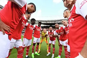 Arsenal's Unstoppable Force: The Huddle Before Battle Against Tottenham in the Premier League (2022-23)