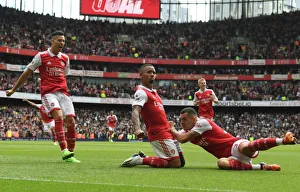 Arsenal's Unstoppable Trio: Jesus, Martinelli, and Xhaka's Goal Celebration in Arsenal's Triumph over Tottenham (2022-23 Premier League)