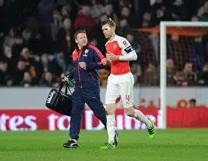 15/16 Hull City V Arsenal FA Cup Prints: Arsenal's Unwavering Duo: Per Mertesacker and Colin Lewin during the FA Cup Fifth Round Replay vs Hull City