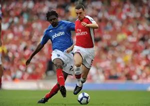 Arsenal's Vermaelen and Kanu Celebrate 4-1 Victory Over Portsmouth at Emirates Stadium, 2009
