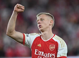 Arsenal v Manchester City 2023-24 Collection: Arsenal's Victory Over Manchester City: Zinchenko Celebrates with Arsenal Fans (2023-24)
