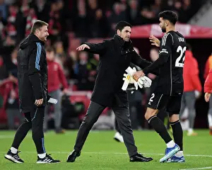 Arsenal's Victory: Mikel Arteta Celebrates with David Raya after Arsenal v Burnley in 2023-24 Premier League