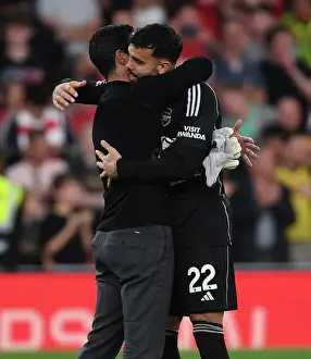 Arsenal's Victory: Mikel Arteta Celebrates with David Raya after Beating Manchester City (2023-24)
