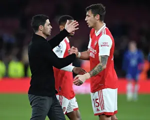 Arsenal V Chelsea 2022-23 Prints: Arsenal's Victory: Mikel Arteta Embraces Jakob Kiwior After Arsenal v Chelsea Match