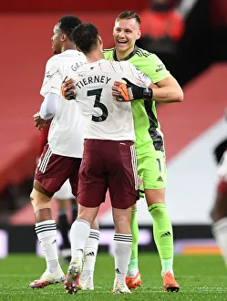 Arsenal's Victory at Old Trafford: Bernd Leno and Kieran Tierney Celebrate in Empty Old Trafford (Manchester United vs Arsenal, 2020-21)