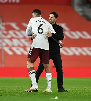 Manchester United V Arsenal 2020-21 Prints: Arsenal's Victory at Old Trafford: Arteta and Gabriel Celebrate Amidst Empty Stands (Manchester United vs Arsenal)