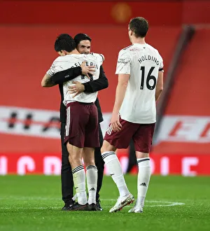 Arsenal's Victory at Old Trafford: Arteta and Bellerin Celebrate Amidst Empty Stands (Manchester United vs Arsenal, 2020-21)