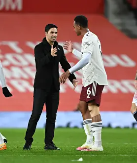 Manchester United V Arsenal 2020-21 Prints: Arsenal's Victory at Old Trafford: Mikel Arteta Congratulates Gabriel