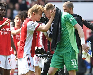 Images Dated 23rd April 2022: Arsenal's Victory: Ramsdale and Odegaard Celebrate Over Manchester United