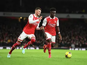 Arsenal V Newcastle United 2022-23 Prints: Arsenal's White and Saka in Action: A Premier League Battle - Arsenal vs Newcastle United