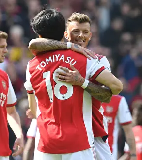 Arsenal's White and Tomiyasu Celebrate Victory Over Manchester United in Premier League