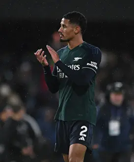 Arsenal's William Saliba Celebrates with Fans after Fulham Victory, 2023-24 Premier League