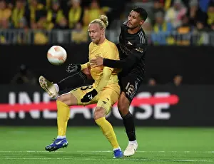 Bodø/Glimt V Arsenal 2022-23 Prints: Arsenal's William Saliba Faces Off Against Bodo/Glimt's Lars Salvesen in Europa League Clash