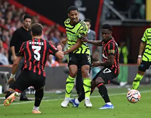 Arsenal's William Saliba Faces Pressure from Bournemouth's Luis Sinisterra in Premier League Clash (AFC Bournemouth vs Arsenal 2023-24)