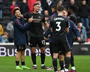 Arsenal's William Saliba and Gabriel Martinelli Celebrate Victory over Fulham in Premier League