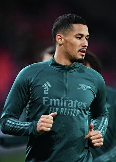 PSV Eindoven v Arsenal 2023-24 Collection: Arsenal's William Saliba Gears Up: PSV Eindhoven vs Arsenal, UEFA Champions League 2023/24