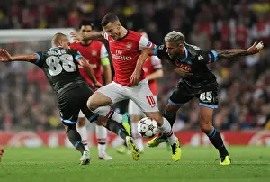 Arsenal V Napoli 2013-14 Prints: Arsenal's Wilshere Faces Off Against Inler and Behrami of Napoli in Champions League Clash