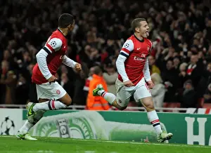 Arsenal V Montpellier 2012-13 Prints: Arsenal's Wilshere and Oxlade-Chamberlain Celebrate Goal Against Montpellier (2012-13)