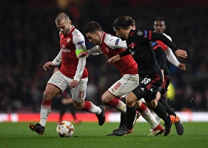 Images Dated 15th March 2018: Arsenal's Wilshere and Ramsey Clash with Milan's Rodriguez in Europa League Showdown