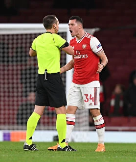 Images Dated 28th November 2019: Arsenal's Xhaka Booked in Europa League Clash Against Eintracht Frankfurt