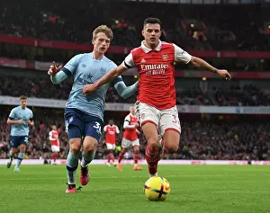 Arsenal V Brentford 2022-23 Prints: Arsenal's Xhaka Clashes with Brentford's Roerslev in Premier League Showdown