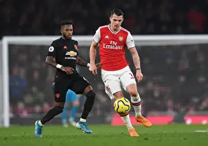 Arsenal V Manchester United 2019-20 Prints: Arsenal's Xhaka Clashes with Manchester United's Fred in Intense Premier League Showdown