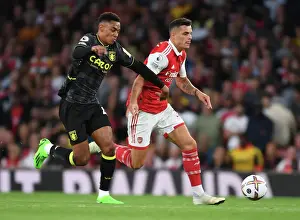 Arsenal's Xhaka Clashes with Villa's Konsa in 2022-23 Premier League Showdown