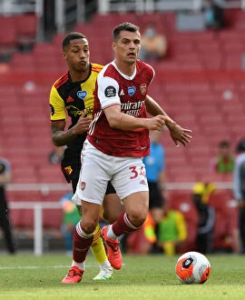 Images Dated 26th July 2020: Arsenal's Xhaka Clashes with Watford's Joao Pedro in Premier League Showdown