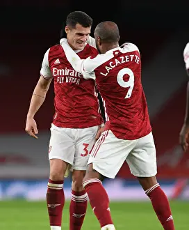 Arsenal's Xhaka and Lacazette Celebrate Goals in Empty Emirates Stadium During Arsenal v Chelsea Match, 2020-21 Premier League