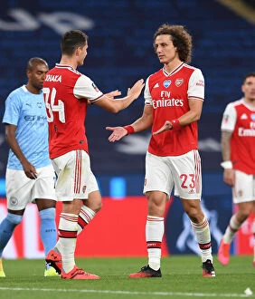 Arsenal v Manchester City - FA Cup Semi-Final 2019-20 Collection: Arsenal's Xhaka and Luiz Embrace After FA Cup Semi-Final Showdown Against Manchester City
