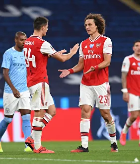 Arsenal V Manchester City - FA Cup Semi-Final 2019-20 Prints: Arsenal's Xhaka and Luiz Embrace After FA Cup Semi-Final Showdown Against Manchester City
