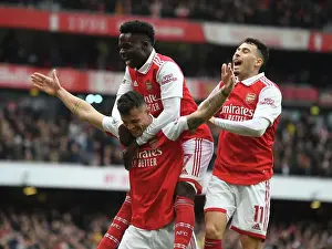 Arsenal's Xhaka, Saka, and Martinelli Celebrate Goals Against Leeds United in 2022-23 Premier League