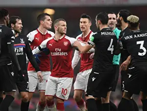 Arsenal's Xhaka and Wilshere Go Head-to-Head with Van Aanholt and Milivojevic: A Midfield Battle in Arsenal vs. Crystal Palace Clash