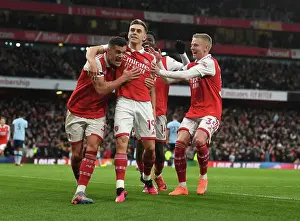 Arsenal's Xhaka, Zinchenko, and Trossard Celebrate Goal Against Brentford (2022-23)