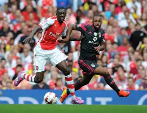 Arsenal V Benfica 2014-15 Prints: Arsenal's Yaya Sanogo Battles Past Benfica's Eliseu in 2014-15 Emirates Cup Clash
