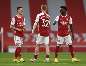 Arsenal V West Bromwich Albion 2020-21 Prints: Arsenal's Young Trio Unite: Behind-Closed-Doors Chat Amidst Empty Emirates Stadium (Arsenal v West Bromwich Albion)