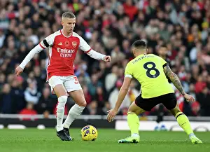 Arsenal's Zinchenko Fends Off Burnley's Brownhill in Premier League Clash