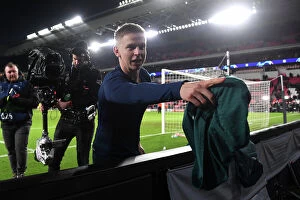 Images Dated 12th December 2023: Arsenal's Zinchenko Gifts Shirt to Ecstatic Fan after PSV Victory - UEFA Champions League 2023/24